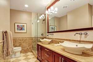 Frameless Shower Door and Vanity Mirror in Bathroom